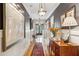 Elegant hallway featuring hardwood floors, stylish lighting, and sophisticated decor at 935 Royall Ave, Mount Pleasant, SC 29464