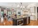 Open-concept kitchen with center island and stainless steel appliances adjacent to living spaces at 935 Royall Ave, Mount Pleasant, SC 29464