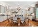 Large kitchen with an island, pendant lights, and hardwood floors at 935 Royall Ave, Mount Pleasant, SC 29464