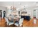 Open kitchen with island, modern appliances, hardwood floors, and custom cabinetry at 935 Royall Ave, Mount Pleasant, SC 29464