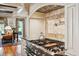 Gourmet kitchen with stainless steel range, pot filler, and custom cabinetry with corbels at 935 Royall Ave, Mount Pleasant, SC 29464