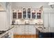 Kitchen featuring custom glass cabinetry and granite countertops at 935 Royall Ave, Mount Pleasant, SC 29464