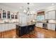 Elegant kitchen with island, granite countertops, and stainless steel appliances at 935 Royall Ave, Mount Pleasant, SC 29464