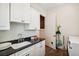Laundry room features white cabinets, granite countertops, and a utility sink at 935 Royall Ave, Mount Pleasant, SC 29464