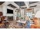 Spacious living room with a fireplace, coffered ceilings, and hardwood floors at 935 Royall Ave, Mount Pleasant, SC 29464