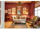 Cozy living room with stylish decor, a plush sofa, and an elegant mirror at 935 Royall Ave, Mount Pleasant, SC 29464
