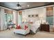 Stylish primary bedroom showcasing a dark ceiling, patterned wallpaper, and natural light at 935 Royall Ave, Mount Pleasant, SC 29464