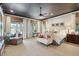 Elegant bedroom with patterned wallpaper, neutral carpet, and a comfortable sitting area at 935 Royall Ave, Mount Pleasant, SC 29464