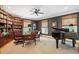 Spacious office with floor-to-ceiling bookshelves, a grand piano, a ceiling fan, and hardwood floors at 935 Royall Ave, Mount Pleasant, SC 29464