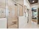Walk-in shower with a glass door and bench seating in a neutral toned bathroom at 935 Royall Ave, Mount Pleasant, SC 29464