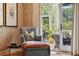 Cozy reading nook by the porch exit features a side table and artwork at 935 Royall Ave, Mount Pleasant, SC 29464