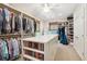 Spacious walk-in closet with custom shelving, drawers, and ample hanging space for organized storage at 935 Royall Ave, Mount Pleasant, SC 29464
