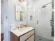 Modern bathroom with a sleek vanity, a large mirror, and a glass-enclosed shower, combining style and functionality at 1 Percy St, Charleston, SC 29403