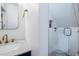 Modern bathroom with a glass enclosed shower and stylish gold fixtures at 1 Percy St, Charleston, SC 29403