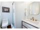 Bright bathroom with a modern toilet and a glass-door shower at 1 Percy St, Charleston, SC 29403