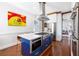 Modern kitchen with custom island, marble counters, and stainless appliances at 1 Percy St, Charleston, SC 29403