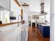 Modern kitchen with white cabinets, stainless steel appliances, and marble countertops at 1 Percy St, Charleston, SC 29403