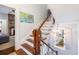 Elegant staircase with wooden railings and a bright window, offering a glimpse of the neighborhood at 1 Percy St, Charleston, SC 29403