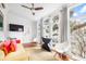 Bright sunroom with large windows, cozy seating, and modern decor at 1 Percy St, Charleston, SC 29403