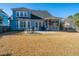 Expansive backyard with a patio area, green lawn, and inviting outdoor space for relaxation at 101 Back Creek Ct, Summerville, SC 29485