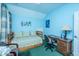 Bright bedroom featuring a daybed, blue walls, and a desk area for studying or hobbies at 101 Back Creek Ct, Summerville, SC 29485