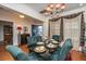 A formal dining room with a decorative chandelier, and a glass topped table at 101 Back Creek Ct, Summerville, SC 29485
