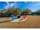 Backyard fire pit with Adirondack chairs, a great outdoor entertaining space at 101 Back Creek Ct, Summerville, SC 29485