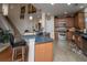 A kitchen island with a breakfast bar overlooks the eat in kitchen and pantry at 101 Back Creek Ct, Summerville, SC 29485