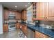 Well-equipped kitchen with stainless steel appliances, wooden cabinets, and ample countertop space at 101 Back Creek Ct, Summerville, SC 29485