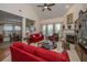 A fireplace, lots of windows and couches are featured in this comfortable living room at 101 Back Creek Ct, Summerville, SC 29485