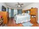 Spacious main bedroom with a ceiling fan, large windows, hardwood floors, and a walk-in closet at 101 Back Creek Ct, Summerville, SC 29485