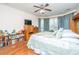 Comfortable main bedroom with a queen-size bed, hardwood floors, and natural light at 101 Back Creek Ct, Summerville, SC 29485