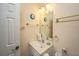 Bright powder room features a white vanity, mirror, and gold fixtures, offering functionality at 101 Back Creek Ct, Summerville, SC 29485