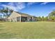 A spacious backyard featuring lush grass and a patio at 1028 Island Preserve Rd, Johns Island, SC 29455