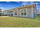 A fenced-in backyard featuring lush grass and a patio with screened-in porch at 1028 Island Preserve Rd, Johns Island, SC 29455