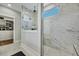 Shower room features marble walls, a small window, and a glass partition at 1028 Island Preserve Rd, Johns Island, SC 29455