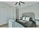 A bright bedroom features a ceiling fan, and a closet with sliding doors at 1028 Island Preserve Rd, Johns Island, SC 29455