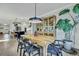 An open dining room features a wooden table, modern light fixture, and hardwood floors at 1028 Island Preserve Rd, Johns Island, SC 29455