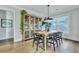 Charming dining room featuring stylish decor, a wooden table, and a decorative display cabinet at 1028 Island Preserve Rd, Johns Island, SC 29455