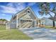 Charming home with a two-car garage, inviting front porch, and well-maintained landscaping at 1028 Island Preserve Rd, Johns Island, SC 29455