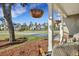 Inviting front porch with hanging plants and rocking chairs, perfect for enjoying neighborhood views at 1028 Island Preserve Rd, Johns Island, SC 29455