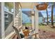 Inviting front porch with rocking chairs and hanging plants, perfect for relaxing outdoors at 1028 Island Preserve Rd, Johns Island, SC 29455