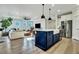 Bright and airy kitchen featuring a central island and stainless steel appliances, flowing into the living area at 1028 Island Preserve Rd, Johns Island, SC 29455