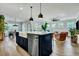 Open concept island kitchen with a large sink and dishwasher looks out on the living room at 1028 Island Preserve Rd, Johns Island, SC 29455