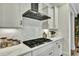 Elegant kitchen featuring a gas range, stainless steel range hood, and subway tile backsplash at 1028 Island Preserve Rd, Johns Island, SC 29455