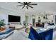 Spacious living room with a modern ceiling fan open to a gourmet kitchen, perfect for entertaining guests at 1028 Island Preserve Rd, Johns Island, SC 29455