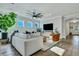 Bright living room with comfortable seating, stylish decor, and hardwood floors at 1028 Island Preserve Rd, Johns Island, SC 29455