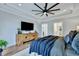 This main bedroom boasts tray ceilings, a ceiling fan, and stylish decor at 1028 Island Preserve Rd, Johns Island, SC 29455