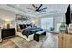 A main bedroom features a tray ceiling, modern ceiling fan, and stylish decor at 1028 Island Preserve Rd, Johns Island, SC 29455