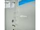 White tiled shower boasts two corner shelves, sleek fixtures, and a small window for natural light at 1028 Island Preserve Rd, Johns Island, SC 29455